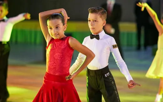 a boy and girl dancing