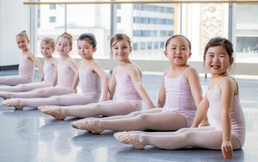 a group of children sitting on the floor