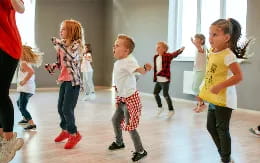 a group of children dancing