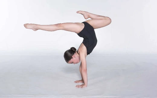 a person doing a handstand