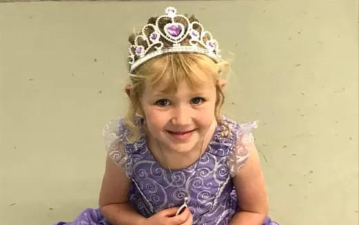 a girl wearing a crown