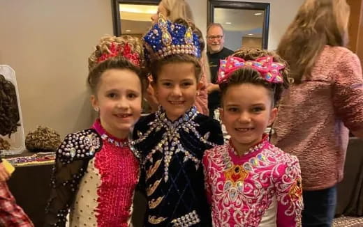 a group of girls wearing headdresses