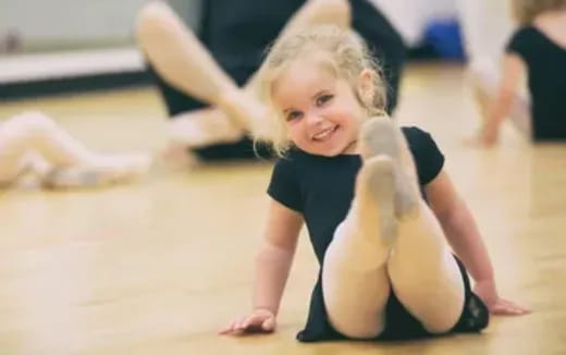 a young girl doing yoga