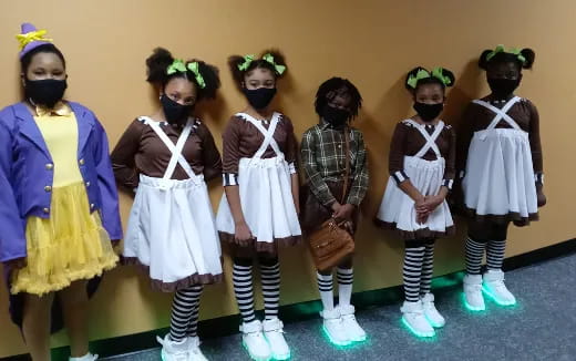 a group of girls in clothing