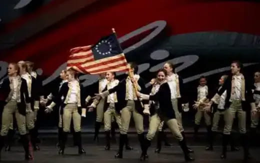 a group of people holding a flag