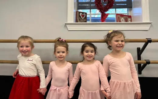 a group of girls in dresses