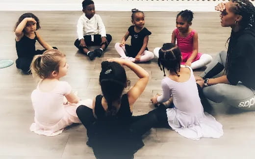 a group of people sitting on the ground
