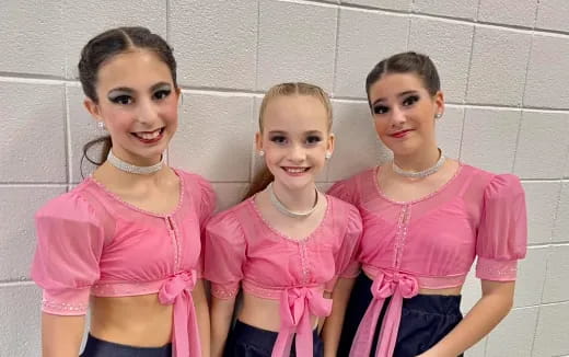 a group of girls posing for a photo