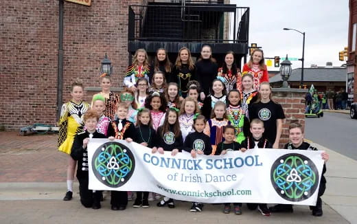 a group of people holding a sign