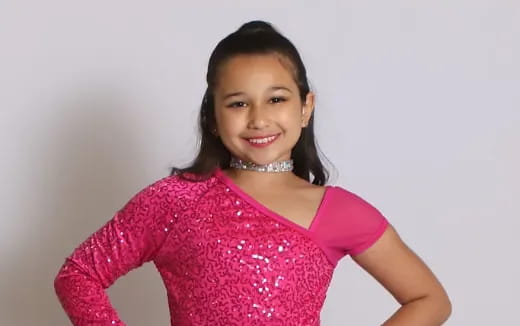 a girl smiling for the camera