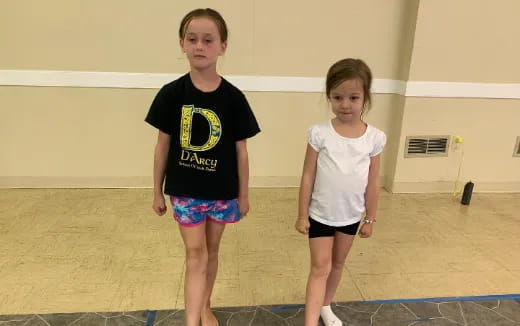 a boy and girl posing for a picture