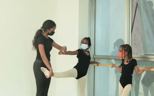 a group of women in black