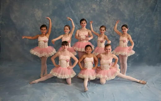 a group of women in dresses