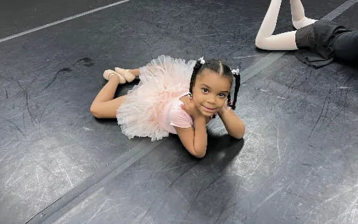 a baby lying on the ground