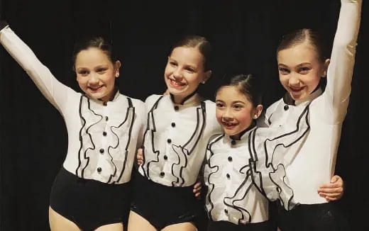 a group of children posing for a photo