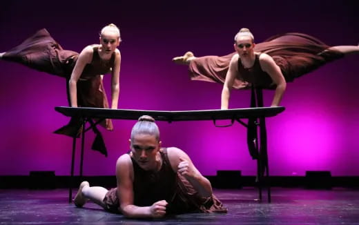 a group of people dancing on a stage