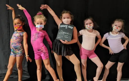 a group of girls wearing clothing