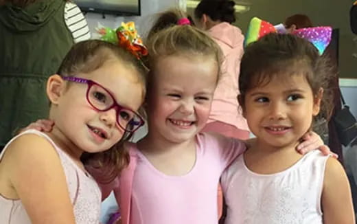 a group of girls posing for a photo