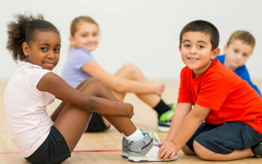 a group of children sitting on the floor