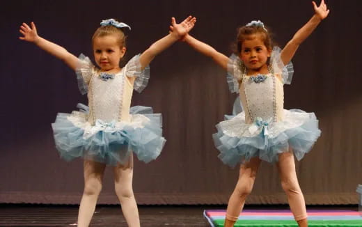 a couple of girls dancing