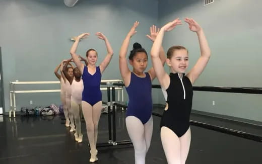 a group of girls in a dance class