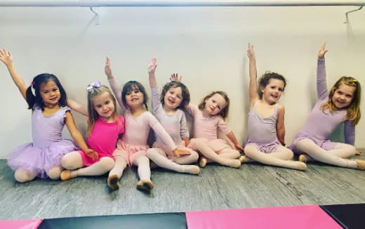 a group of girls in dresses