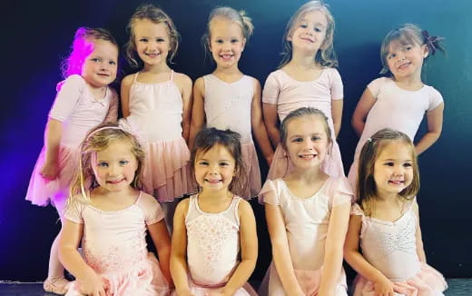 a group of girls posing for a picture