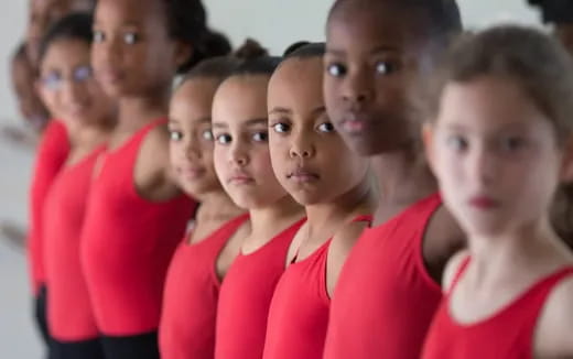 a group of people in red shirts