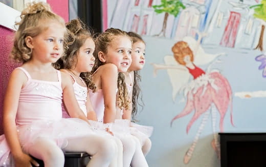 a group of girls sitting on a couch