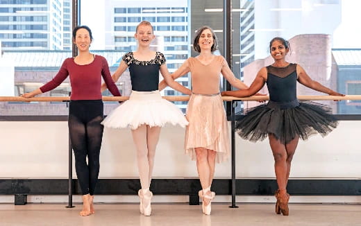 a group of women posing for a photo