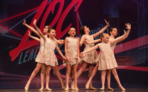 a group of women dancing on a stage