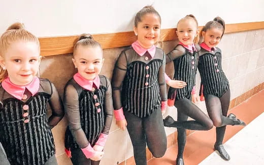 a group of children posing for a photo