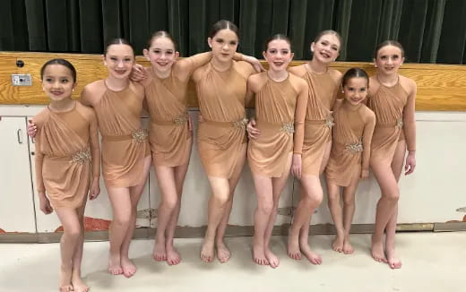 a group of women in matching outfits