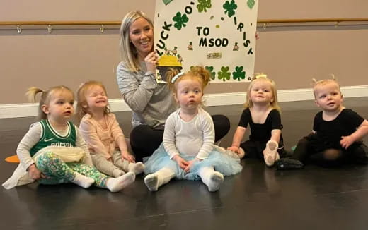 a group of children sitting on the floor