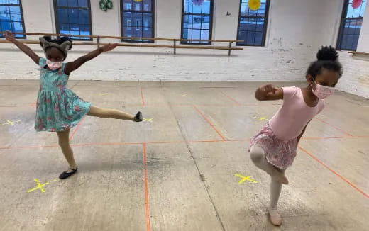 a couple of girls dancing