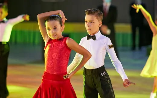 a boy and girl dancing