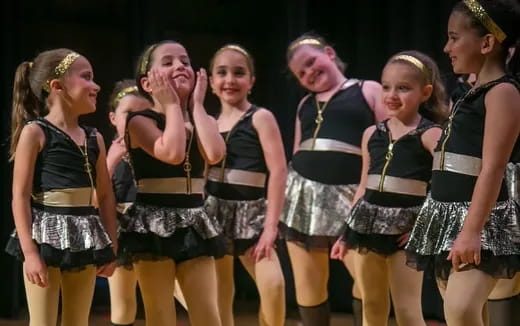 a group of girls in a row