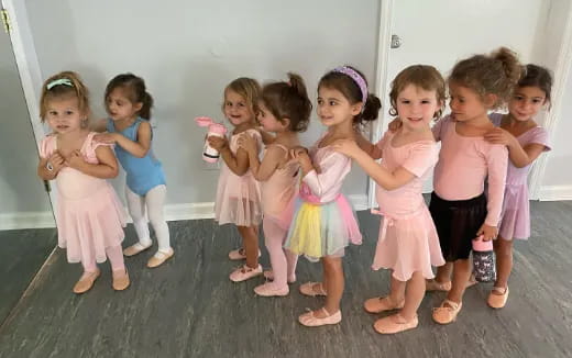 a group of children in dresses