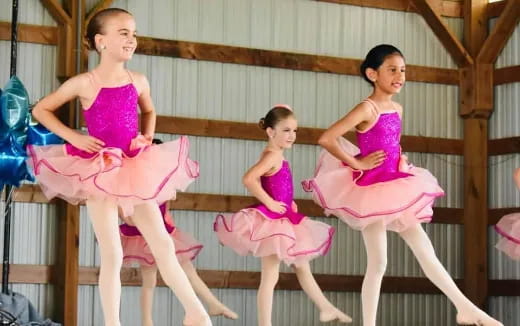 a group of girls in dresses