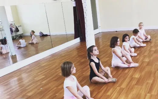 a group of women sitting on the floor