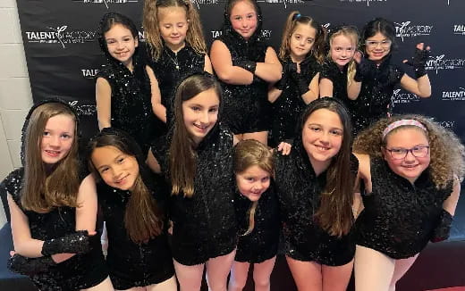 a group of women posing for a photo