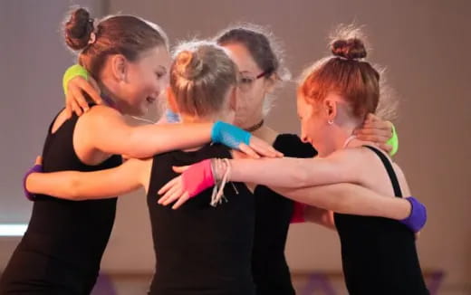 a group of women hugging