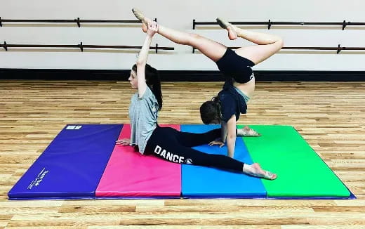 a couple of women doing yoga