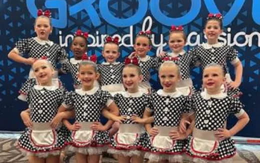 a group of women posing for a photo