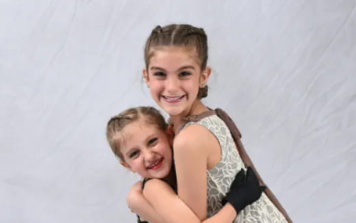 a couple of girls hugging