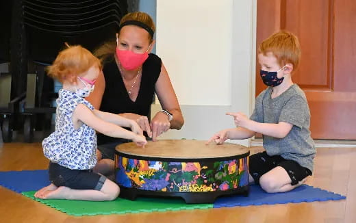 a group of children playing with a toy