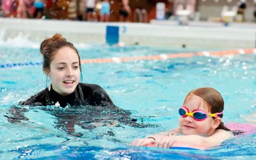 a couple of girls in a pool