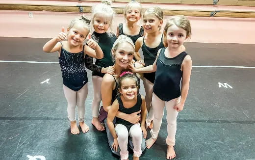 a group of girls posing for a photo