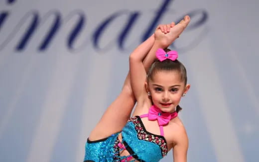 a girl with her hands up