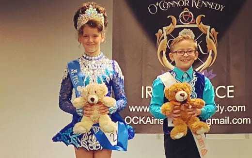 two children holding stuffed animals